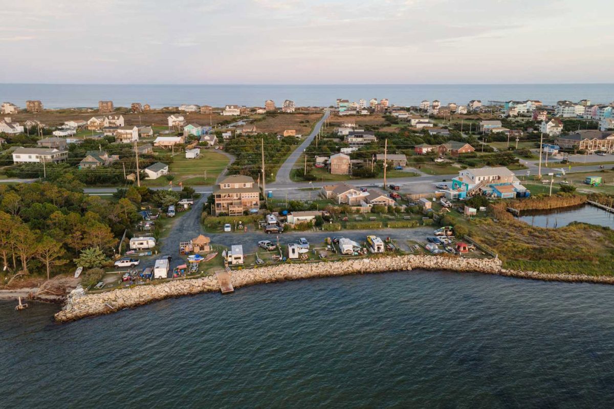 An aerial view of the water-side campground, Rodanthe Watersports and Campground, one of the most popular campgrounds with views on Campspot. 