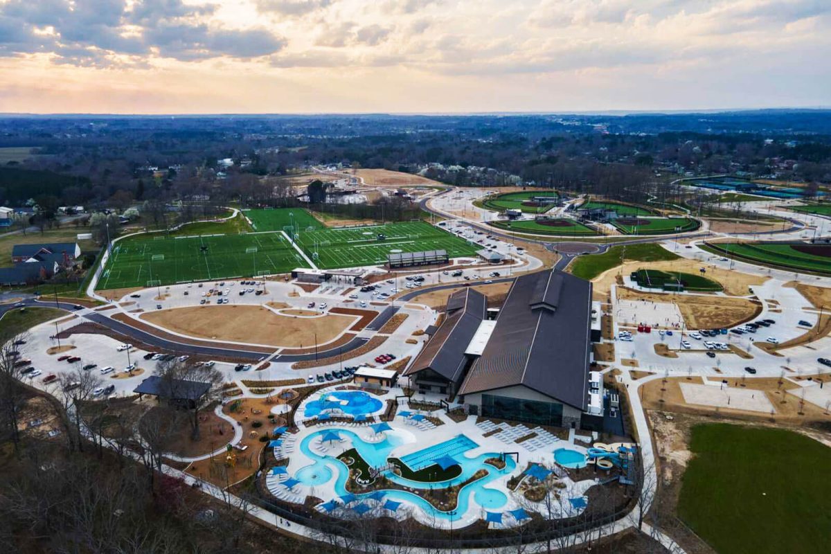 An aerial view of the campground and water park at Sand Mountain Park & Amphitheater. A football field is visible in the distance. 