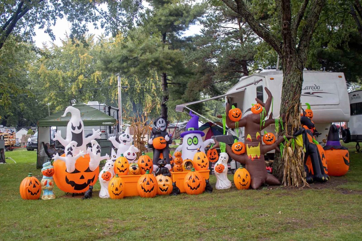 inflatable pumpkins, ghosts, and Halloween decorations at campground