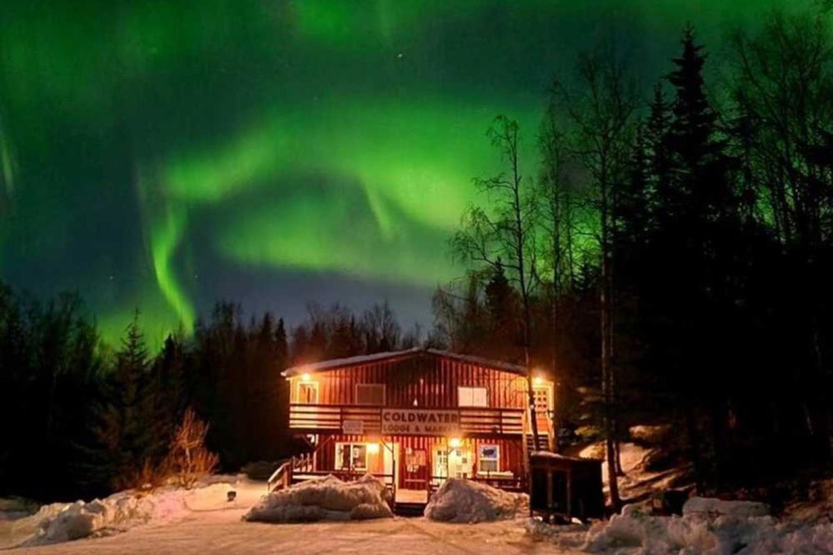 Coldwater lodge, one of the best places to camp in Alaska, nestled under northern lights