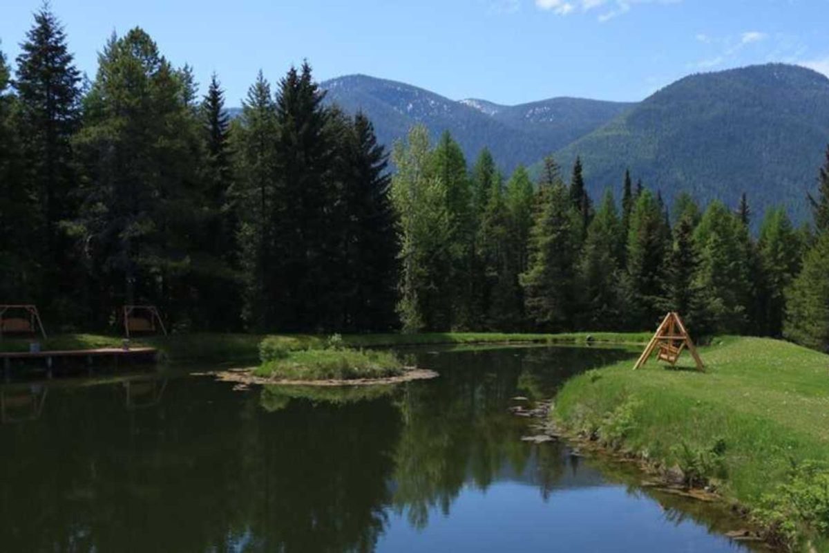 peaceful lake and swings at one of the best places to camp