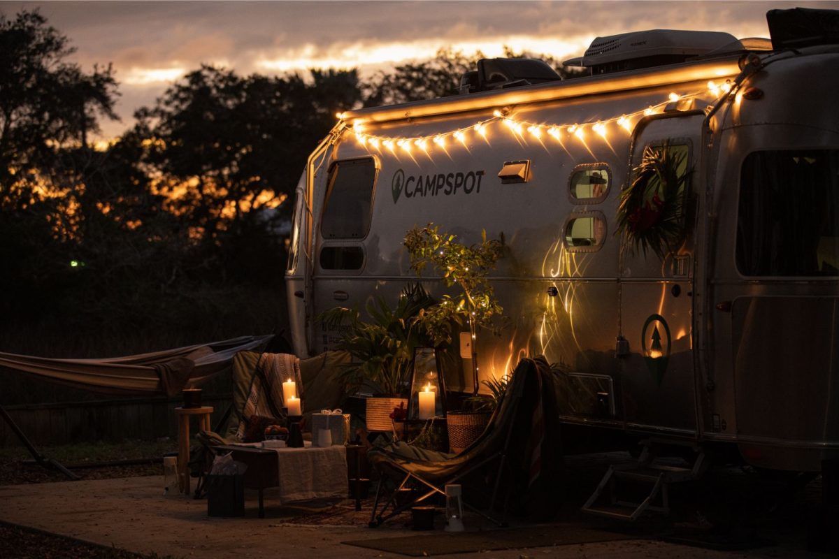 RV decorated with string lights and candles