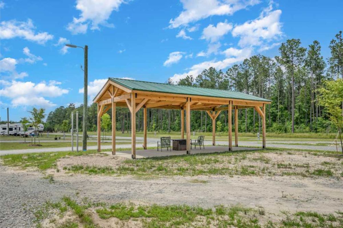 wooden pergola with RVs and trees nearby at campground near Durham, North Carolina