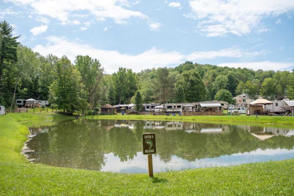 RVs parked next to catch-and-release pond at campground near Rochester, NY