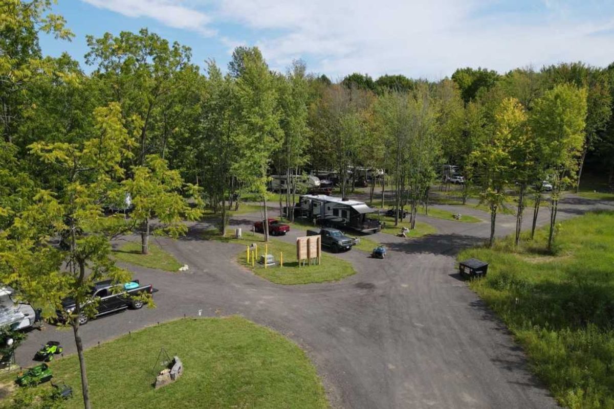 RVs parked among trees at Rochester campground