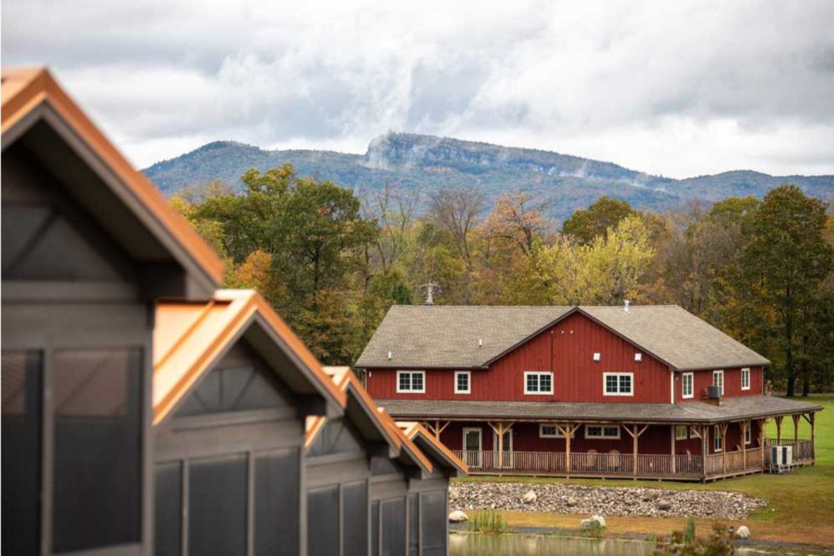 view of red cabin lodge at campground for weekend getaway from NYC