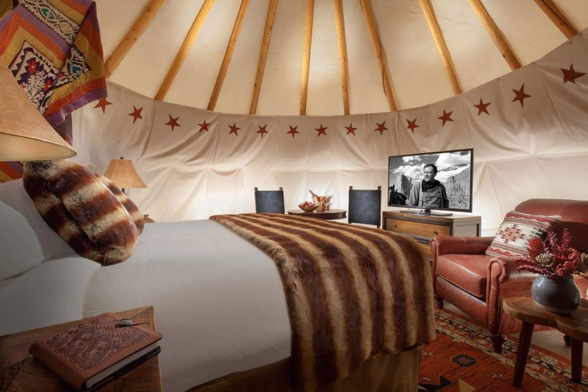 bed and tv inside glamping tent at Smoky Hollow Outdoor Resort campground near Gatlinburg and Pigeon Forge