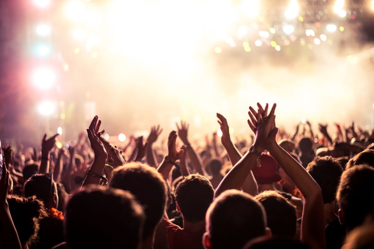 people's hands up at Coachella festival