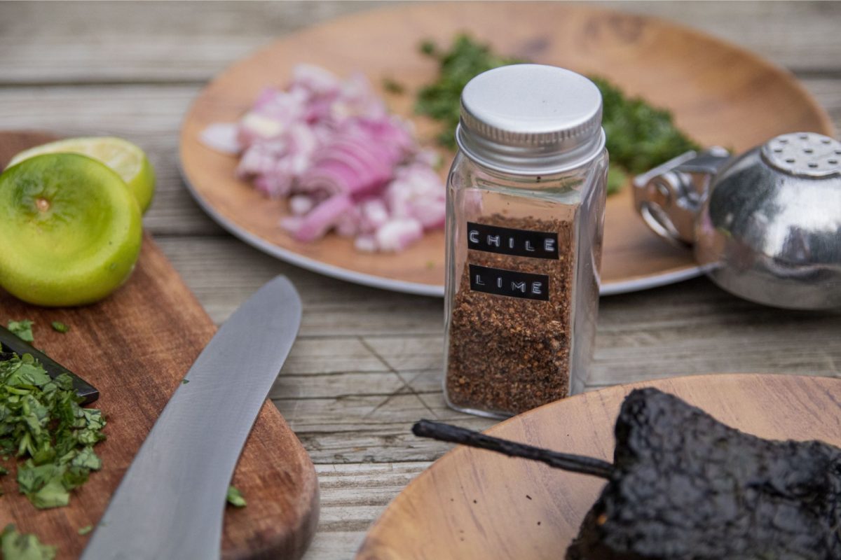 chile lime seasoning on table with camping utensils and plates