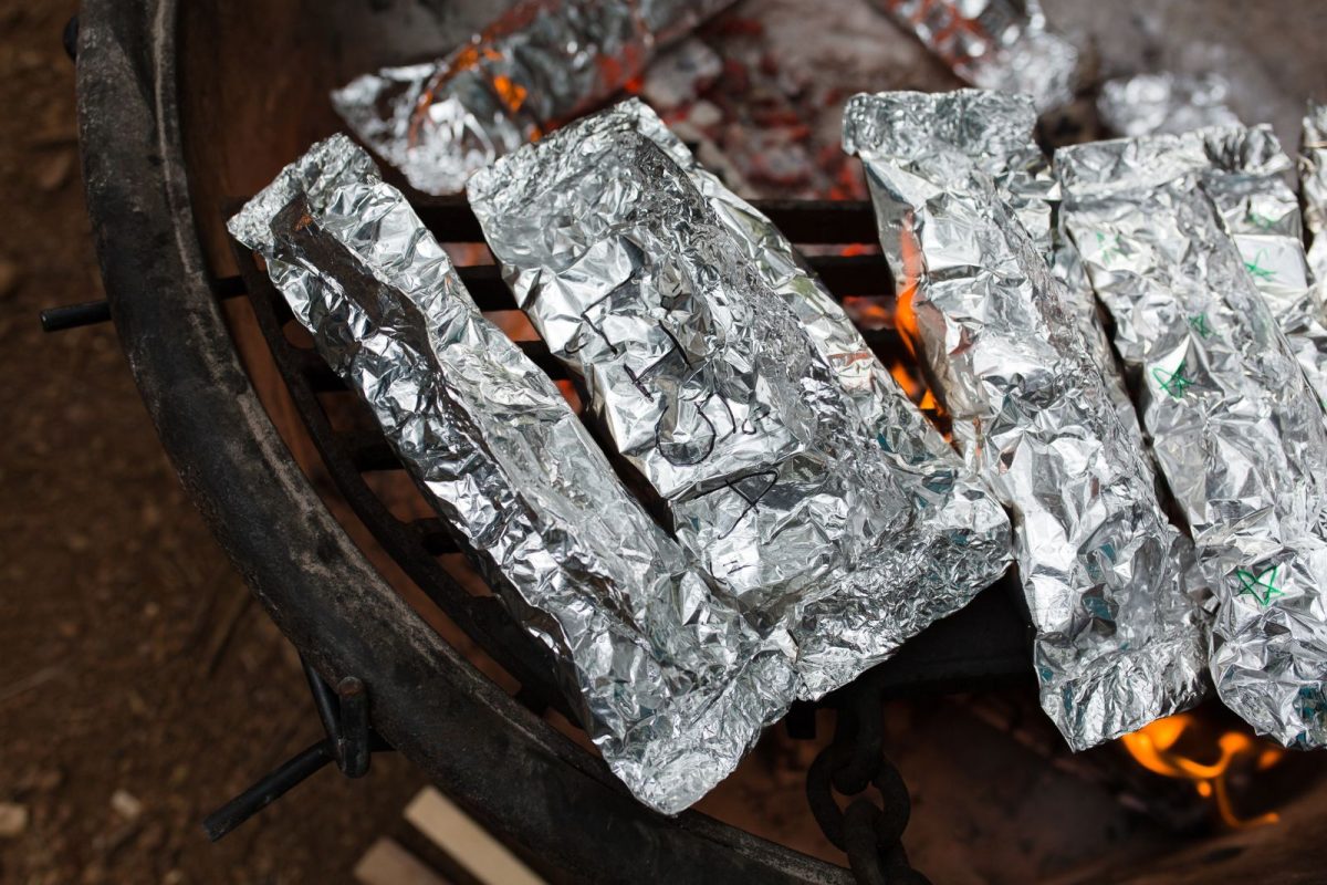 aluminum foil packet meals cooking over campfire for budget camping under $300