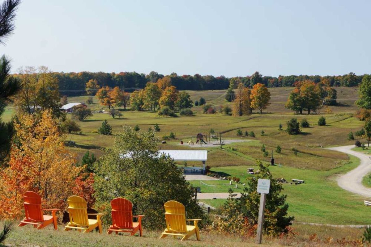 lawn chairs overlooking fall trees at fall camping destination Chandler Hill Campground