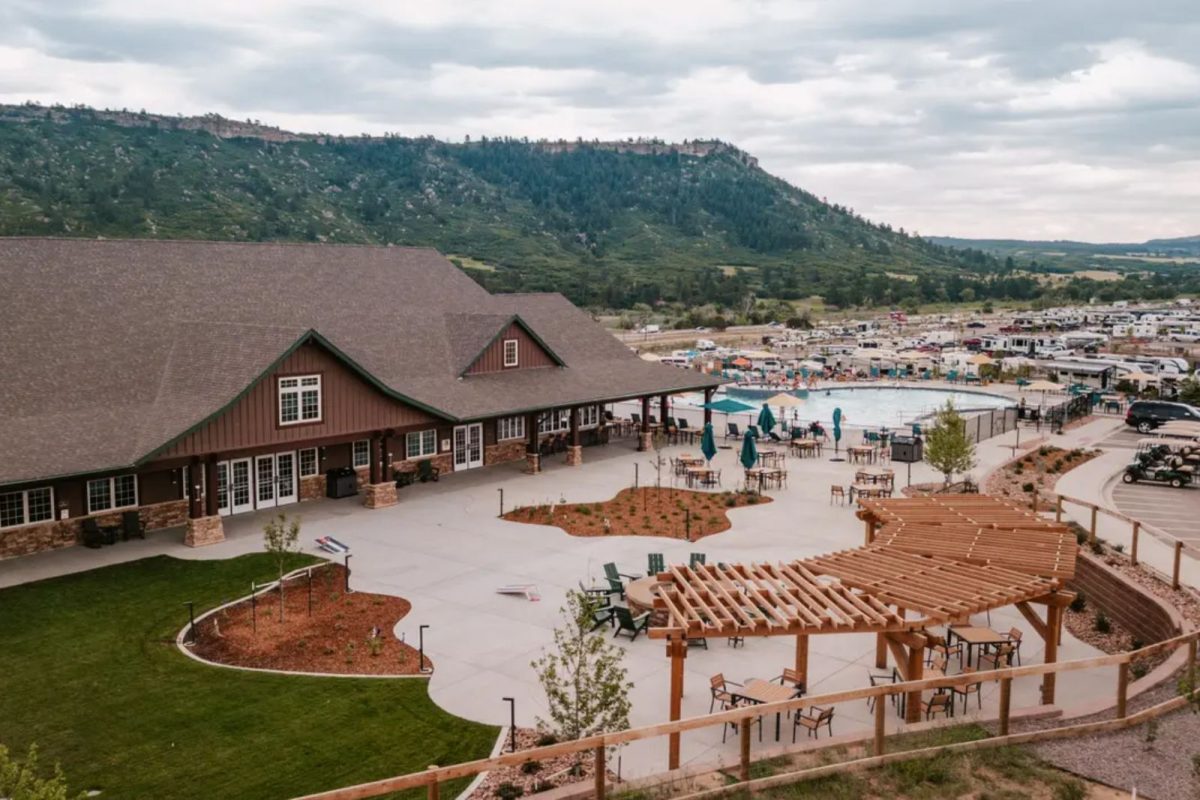 view of lodge, pool, and campground near hills at Jellystone Camp Resort: Larkspur