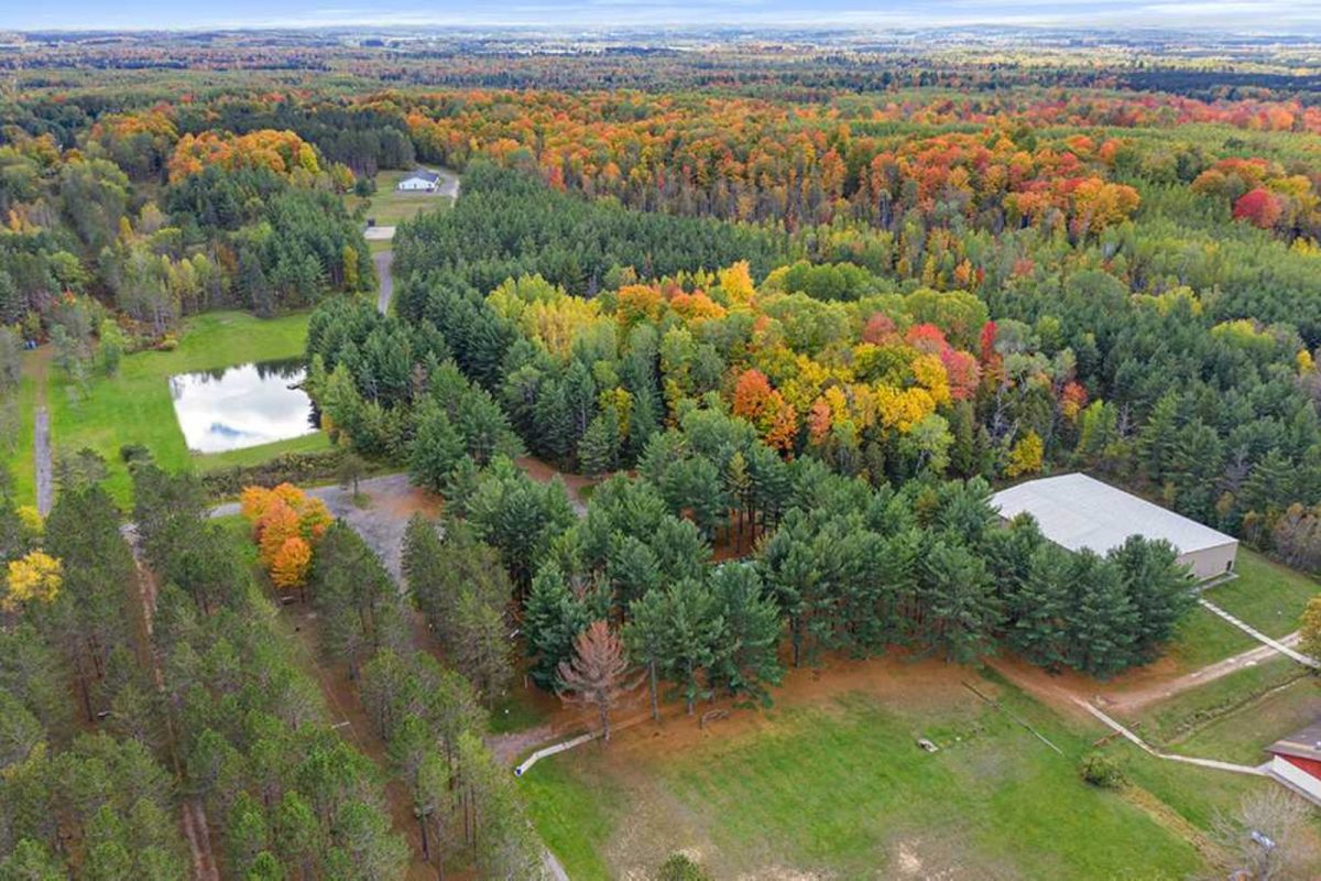 aerial view of fall trees at one of top fall camping destinations Manton Trails RV Park