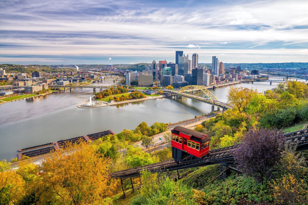 aerial view of downtown Pittsburgh with red gondola train  during fall