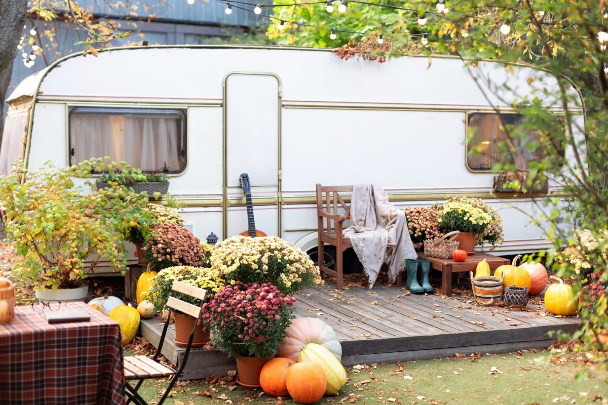 RV camper decorated with pumpkins and lights for Thanksgiving gathering