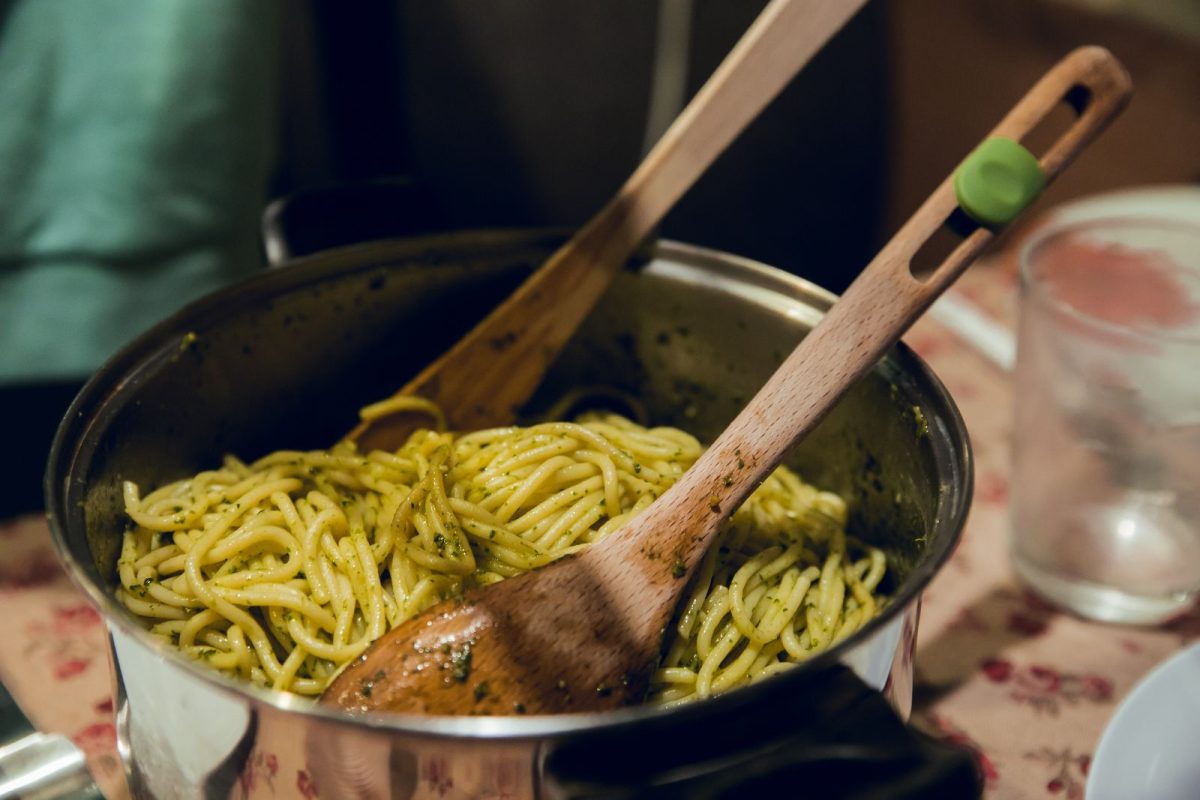 pasta and servingware in pot for small gathering in RV