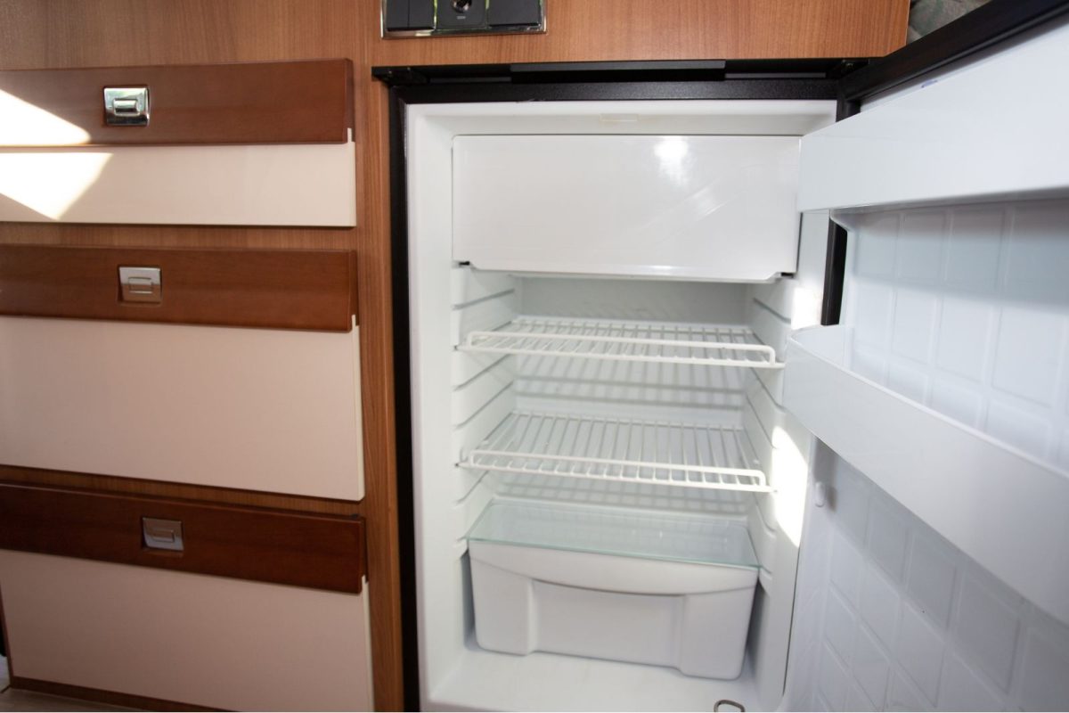 empty fridge in RV, ready for hosting a gathering