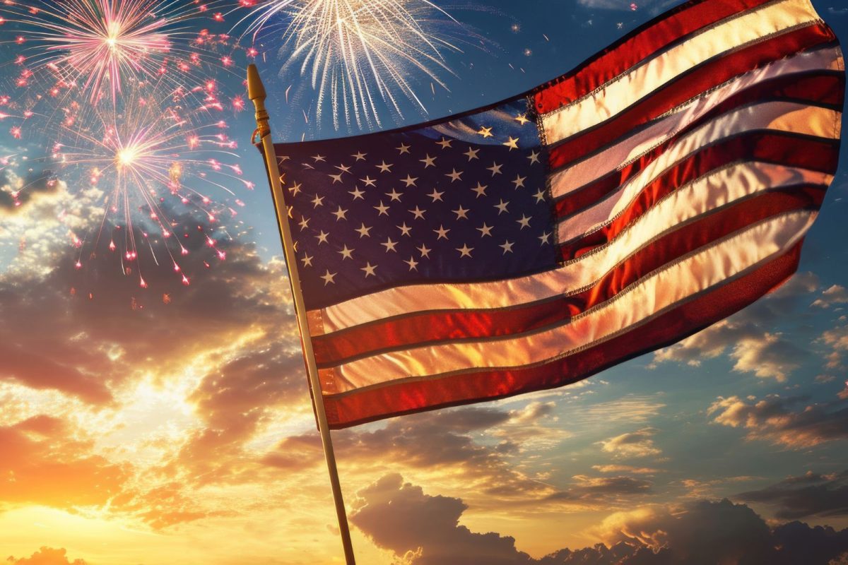 American flag waving in celebration with fireworks in background