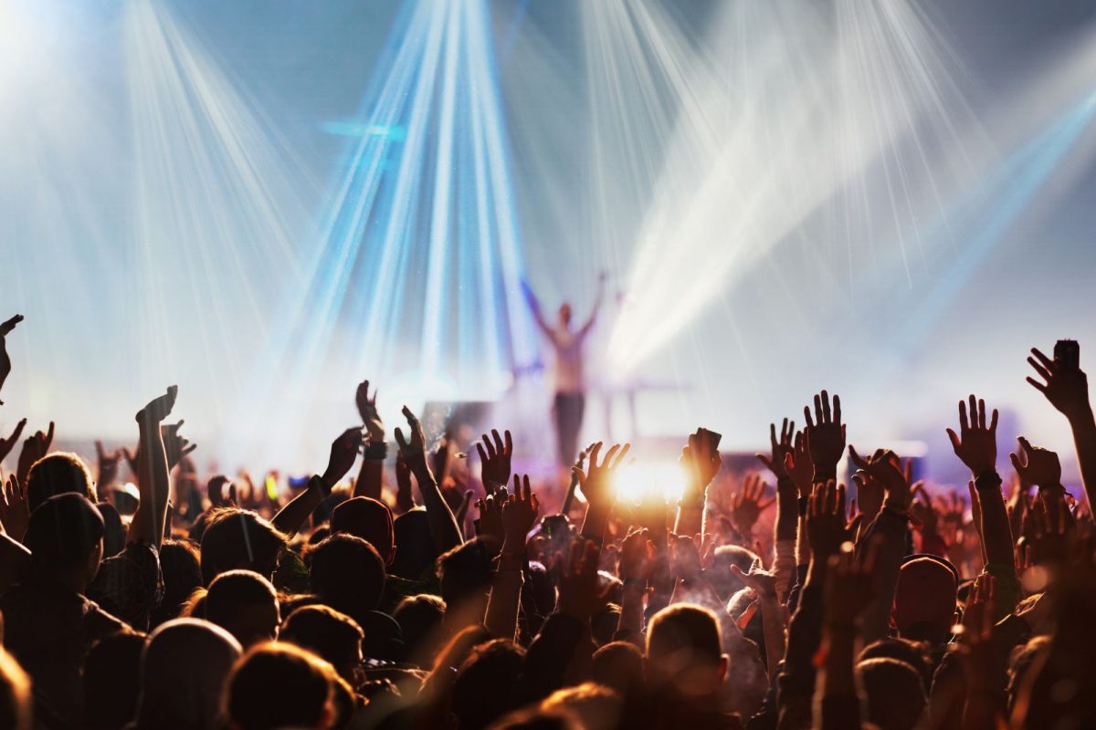 people raising their hands at ACL for music-focused camping events