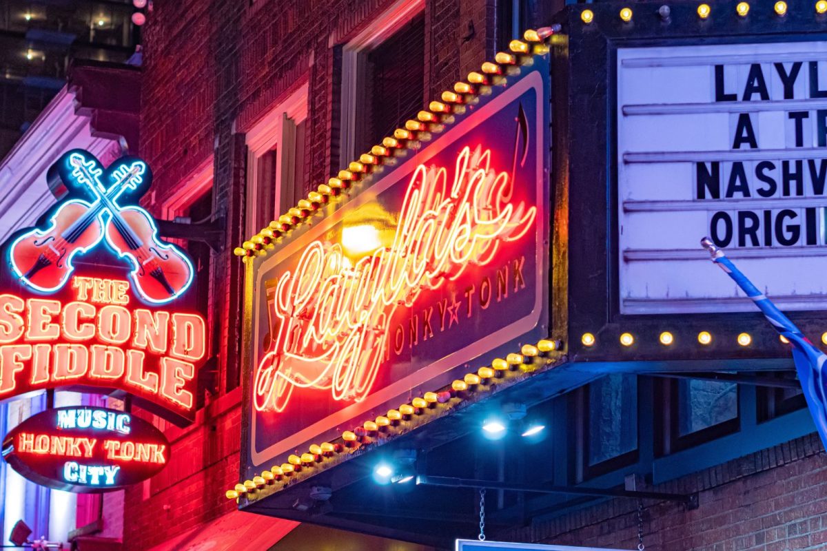 neon signs in downtown Nashville for CMA Fest, major camping event