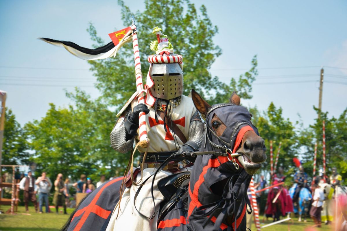 medieval rider on horse in renaissance festival, on list of top camping events