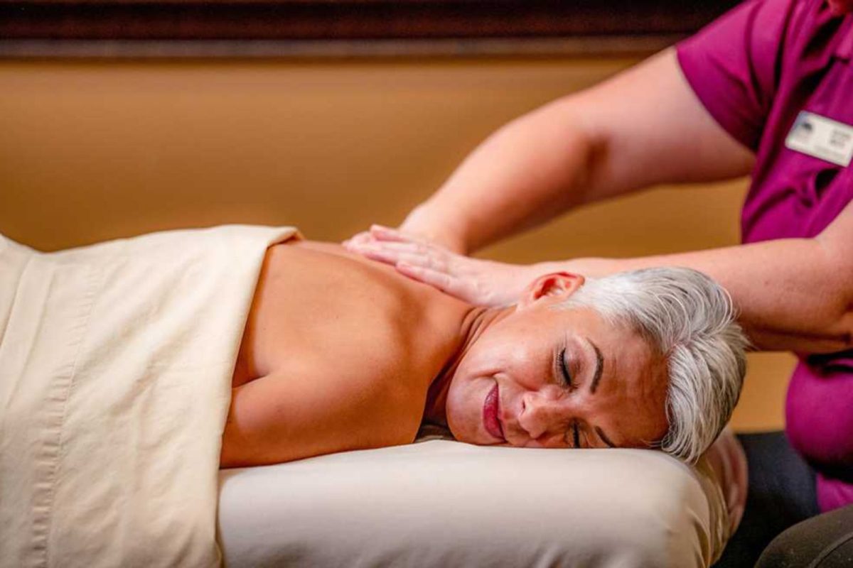 woman getting massage at luxury resort campground