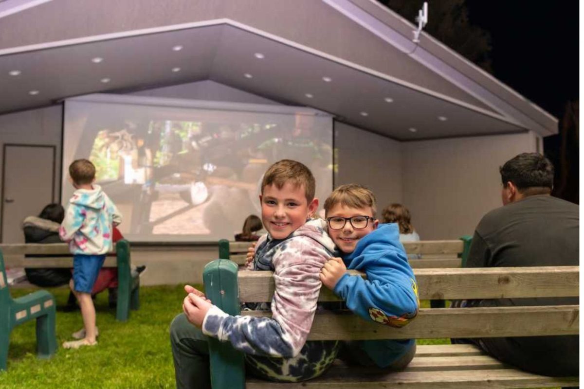 two boys at movie night at luxury RV resort campground