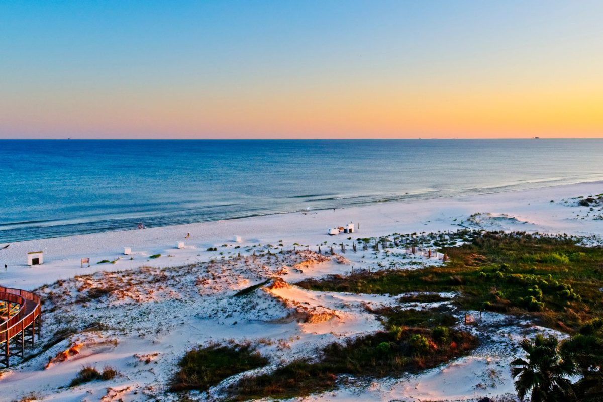 sunset over white beaches of Gulf Shores near Foley, AL, spring break RV destination